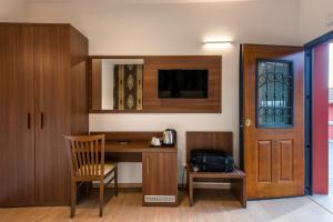 TV a/nebo společenská místnost v ubytování Domus Porto Di Traiano Resort