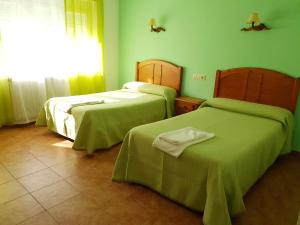 Postel nebo postele na pokoji v ubytování Hostal Río Mundo