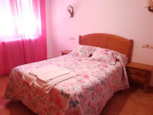 Postel nebo postele na pokoji v ubytování Hostal Río Mundo