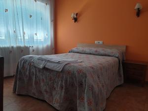 Postel nebo postele na pokoji v ubytování Hostal Río Mundo