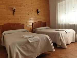 Postel nebo postele na pokoji v ubytování Hostal Río Mundo