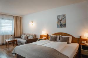 Łóżko lub łóżka w pokoju w obiekcie Hotel Bergjuwel