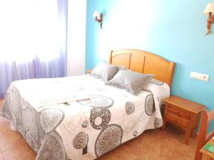 Postel nebo postele na pokoji v ubytování Hostal Río Mundo