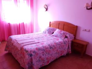 Postel nebo postele na pokoji v ubytování Hostal Río Mundo