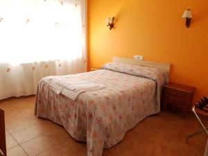 Postel nebo postele na pokoji v ubytování Hostal Río Mundo