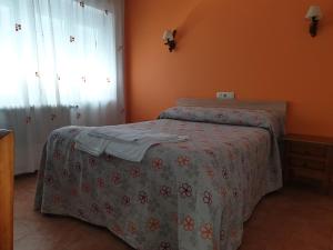 Postel nebo postele na pokoji v ubytování Hostal Río Mundo