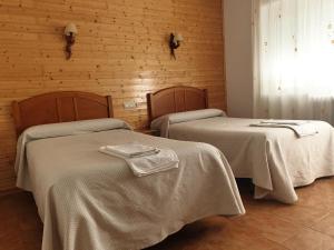 Postel nebo postele na pokoji v ubytování Hostal Río Mundo