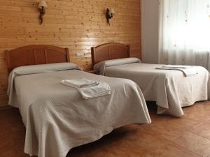 Postel nebo postele na pokoji v ubytování Hostal Río Mundo