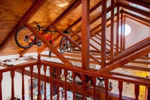 a bike hanging from the ceiling of a room at Elite Escape in Tsoukalades