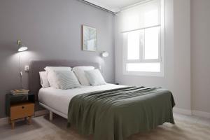מיטה או מיטות בחדר ב-Colón by FeelFree Rentals