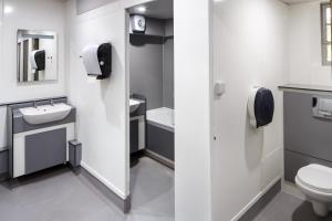 a bathroom with a toilet and a sink at Christ's College Cambridge in Cambridge