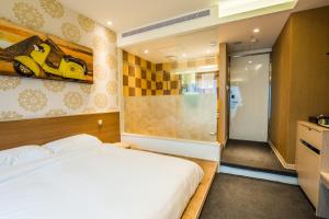 Letto o letti in una camera di Walker Hotel. Ximen