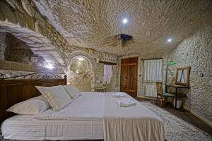Postel nebo postele na pokoji v ubytování Naraca Cave House