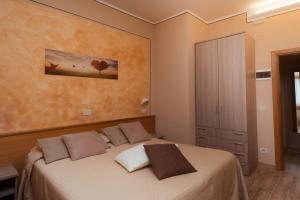Postel nebo postele na pokoji v ubytování Albergo Ristorante il Fungo
