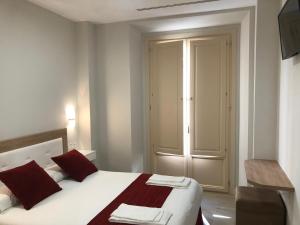 Posteľ alebo postele v izbe v ubytovaní Pinar Malaga Rooms