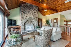 a living room with a couch and a fireplace at 101 Dune Lane in Hilton Head Island