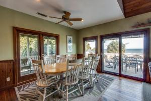 a dining room with a table and chairs at 101 Dune Lane in Hilton Head Island