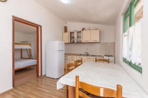 Kuchyň nebo kuchyňský kout v ubytování House Bellatrix + 13 fotografií