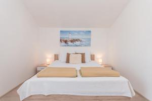 Posteľ alebo postele v izbe v ubytovaní Apartment Lucija + 22 fotografií