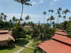 an aerial view of a resort with palm trees at Weligama Bay Resort in Weligama
