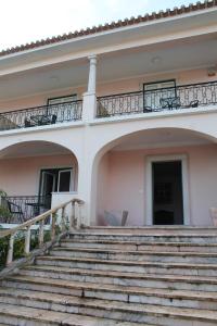 a house with stairs and a balcony at Villa Aedan Sintra in Sintra