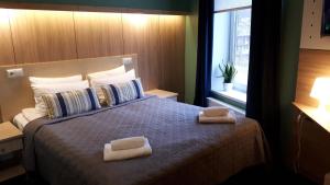 Postel nebo postele na pokoji v ubytování Alba Hotel