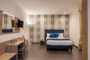 Posteľ alebo postele v izbe v ubytovaní Domus Porto Di Traiano Resort