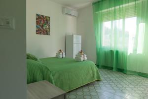 Posteľ alebo postele v izbe v ubytovaní B&B NONNO PEPPE