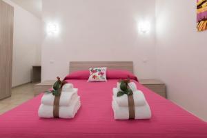 Posteľ alebo postele v izbe v ubytovaní B&B NONNO PEPPE