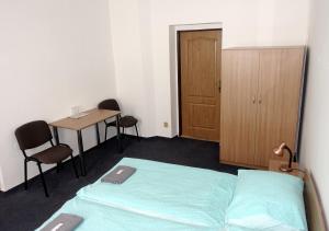 Postel nebo postele na pokoji v ubytování HOTEL STAŘÍČ