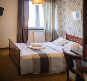 Postel nebo postele na pokoji v ubytování Pod Wzgórzem Bed & Breakfast