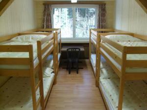 Voodi või voodid majutusasutuse Vista Resort Hostel toas