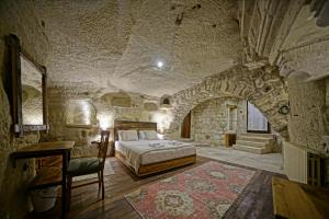 Postel nebo postele na pokoji v ubytování Naraca Cave House