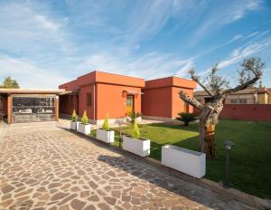 Vonkajšia záhrada v ubytovaní Domus Porto Di Traiano Resort