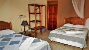 Hotel Tikal Inn客房内的一张或多张床位