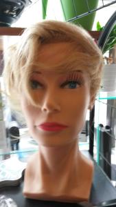 a plastic mannequin with blonde hair and red lipstick at Pension Helgoländ in Dresden