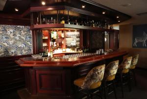 a bar in a restaurant with chairs around it at Restaurant & Hotel Hoog Holten in Holten +42 photos