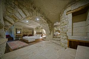 Postel nebo postele na pokoji v ubytování Naraca Cave House