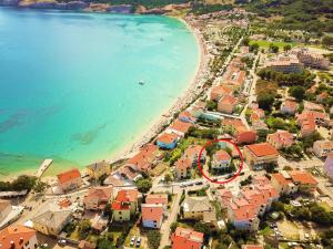 an aerial view of a town next to a beach at Apartment Luiza with Terrace in Baška +10 photos