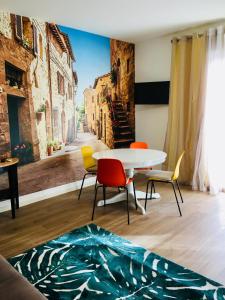 a living room with a table and chairs and a street at RESIDENZA ELENA in Rimini