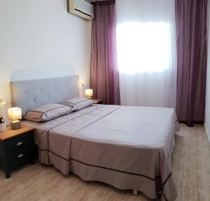 Posteľ alebo postele v izbe v ubytovaní Avenu Belgica Apartment + 8 fotografií