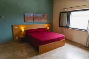 Postel nebo postele na pokoji v ubytování Hotel Poggio Bertino