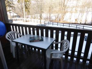 a book sitting on a table on a balcony at GAUDISSARD A612 in Barcelonnette