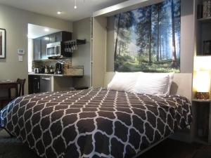 a bedroom with a large bed with a large window at Gondola Lodge & Tahoe Beach Club in South Lake Tahoe +166 photos
