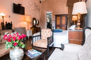 a living room with a bed and a couch at Casa Falleri Boutique Hotel in Lima