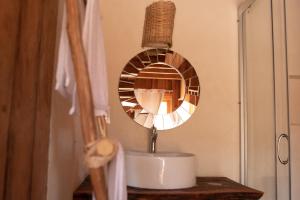 a bathroom sink with a mirror on a counter at LaIsla Holbox Villa in Holbox Island