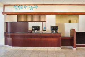 a lobby of a hospital with a reception desk at Maui Beach Hotel in Kahului
