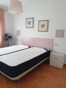 a bedroom with a bed in a room at Sol y Luz in Isla del Moral