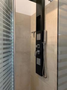 a shower with a phone in a bathroom at Stayinbologna 3 in Bologna