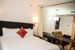 Voodi või voodid majutusasutuse Stain Loft & Suites toas